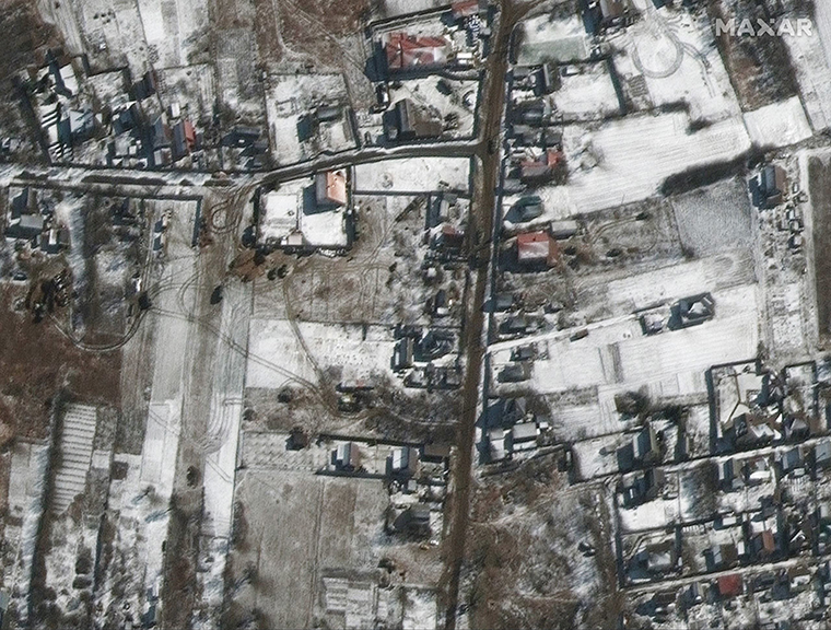 Russian military vehicles are seen sitting on roadways in residential areas in the town of Ozera, Ukraine, 17 miles northwest of Kyiv.