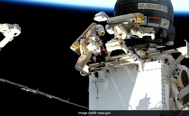 Russian Cosmonauts Spacewalk Outside Space Station Orbiting Above Brazil